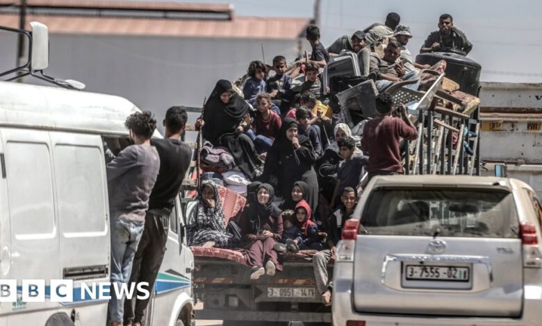 Palestinians cram on to a van after deciding to flee Rafah, as Israeli forces continue a ground operation in the southern Gaza city (8 May 2024)