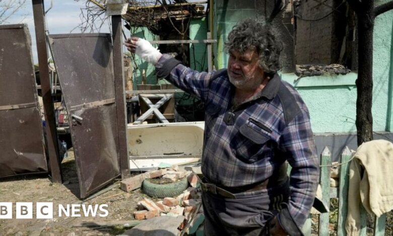 Serhii, a resident of Vovchansk shows his destroyed home