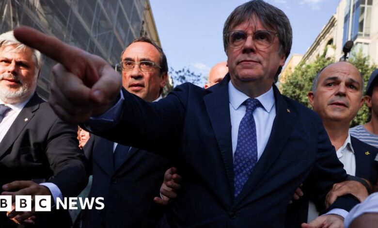 Police hunt former Catalan separatist leader after return from exile