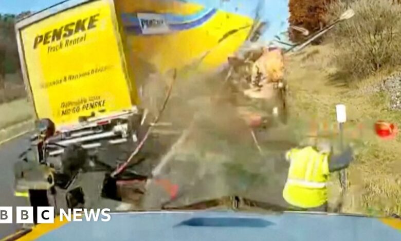 Watch: The moment a worker avoids a collision with a high-speed truck