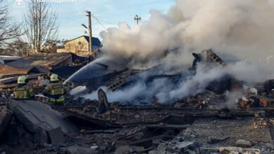 Firefighters douse a Lviv building hit by a Russian missile attack