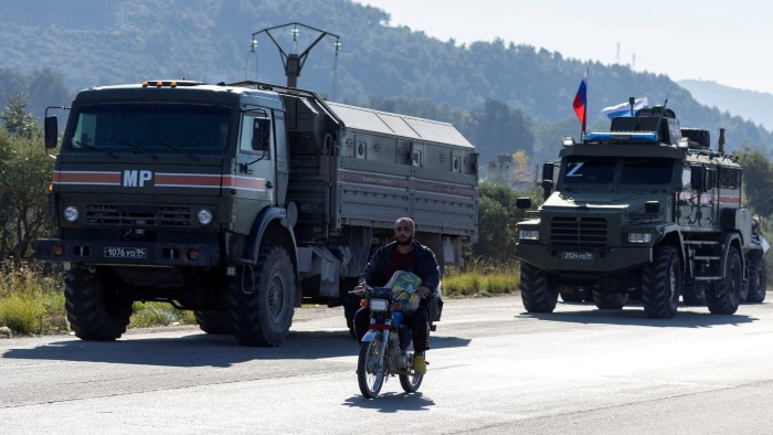 A Russian military convoy heads towards Hmeimim air base