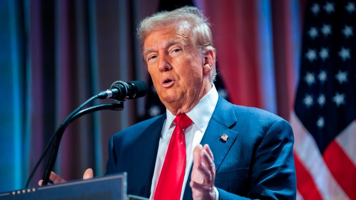 Donald Trump speaks at a podium