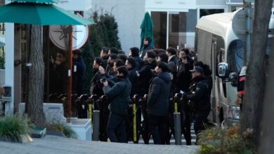 Police officers arrive at the gate of the presidential residence as supporters of impeached South Korean President Yoon Suk Yeol stage a rally to oppose a court having issued a warrant to detain Yoon, in Seoul, South Korea on Friday January 3 2025