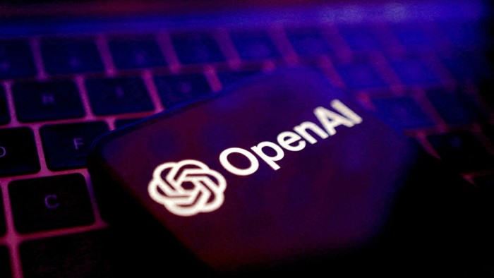 Photo illustration of an Open AI logo over a computer keyboard