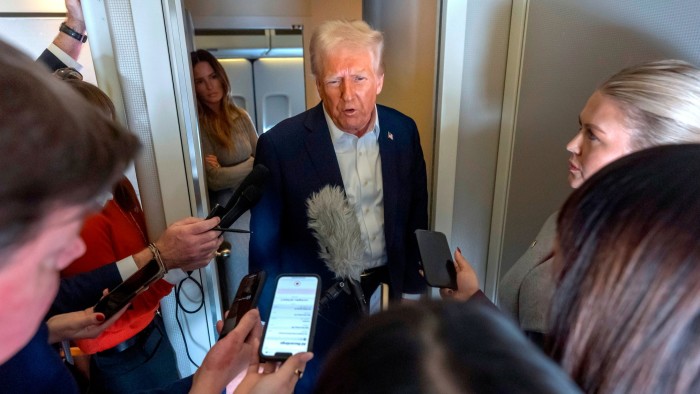 Donald Trump speaking to reporters on Air Force One on Saturday